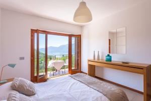 A bed or beds in a room at Italian Lakes villa with lake views