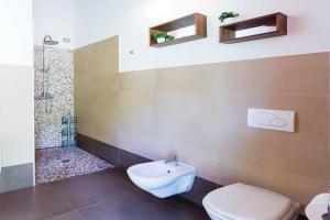 A bathroom at Italian Lakes villa with lake views