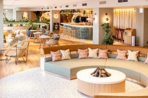 a living room with a couch and a table at Keio Plaza Hotel Tokyo in Tokyo