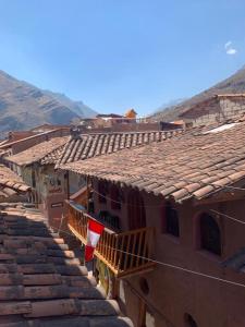 a group of buildings with tile roofs at shanti pisac in Pisac