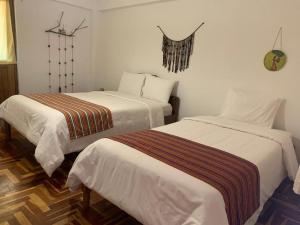 Ein Bett oder Betten in einem Zimmer der Unterkunft shanti pisac