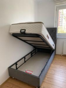 an empty bed in a room with a mattress at A cozy room with brand new furniture in Frankfurt/Main