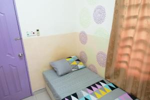 Tempat tidur dalam kamar di Kampung Homestay, Kuantan