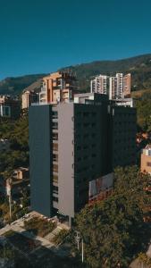 an aerial view of a large building in a city at Versus Hotel in Medellín