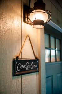 a sign on a wall that reads crepes not cheese at The Alexander at Creek Road in Dripping Springs