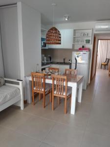 a kitchen and dining room with a table and chairs at Alquiler Temporario SG in Lincoln