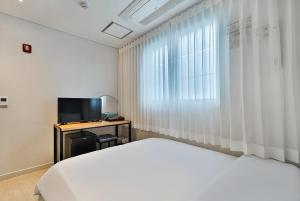 TV a/nebo společenská místnost v ubytování Ciel mini hotel