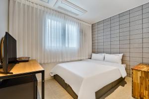 Postel nebo postele na pokoji v ubytování Ciel mini hotel