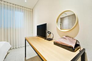 Postel nebo postele na pokoji v ubytování Ciel mini hotel
