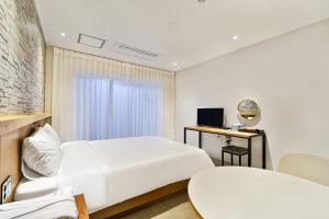 Postel nebo postele na pokoji v ubytování Ciel mini hotel