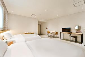 Postel nebo postele na pokoji v ubytování Ciel mini hotel