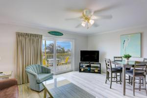 a living room with a table and a dining room at South Beach Condo Hotel by Travel Resort Services, Inc. in St Pete Beach