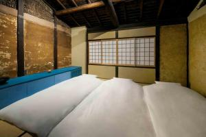 Katil atau katil-katil dalam bilik di Asagi an Machiya House