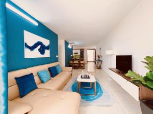 a living room with a couch and a table at Hải Đăng Homestay - Hạ Long in Ha Long