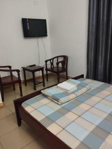 Postel nebo postele na pokoji v ubytování Sứ Lạng Hotel