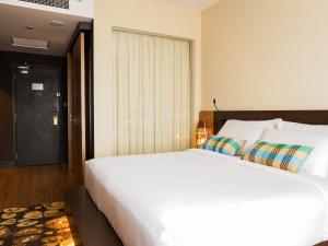 Postel nebo postele na pokoji v ubytování Starus Hotel Bukit Bintang