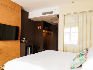 Postel nebo postele na pokoji v ubytování Starus Hotel Bukit Bintang