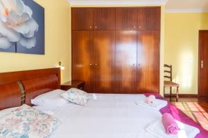 Ένα ή περισσότερα κρεβάτια σε δωμάτιο στο GuestReady - Peaceful Paradise in Madeira