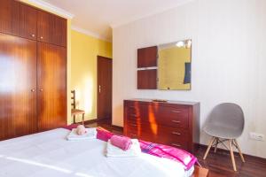 Ένα ή περισσότερα κρεβάτια σε δωμάτιο στο GuestReady - Peaceful Paradise in Madeira