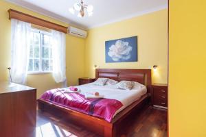 Ένα ή περισσότερα κρεβάτια σε δωμάτιο στο GuestReady - Peaceful Paradise in Madeira