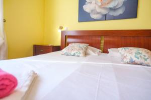 Ένα ή περισσότερα κρεβάτια σε δωμάτιο στο GuestReady - Peaceful Paradise in Madeira