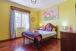 Ένα ή περισσότερα κρεβάτια σε δωμάτιο στο GuestReady - Peaceful Paradise in Madeira