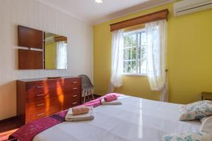 Ένα ή περισσότερα κρεβάτια σε δωμάτιο στο GuestReady - Peaceful Paradise in Madeira