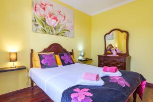 Ένα ή περισσότερα κρεβάτια σε δωμάτιο στο GuestReady - Peaceful Paradise in Madeira