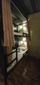 a couple of bunk beds in a room at TAGBALAYON Lodging House in Siquijor