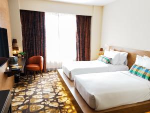 Postel nebo postele na pokoji v ubytování Starus Hotel Bukit Bintang