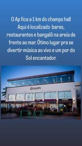 a picture of a building with an advertisement for an airport at Quarto em AP compartilhado Ponta da areia in São Luís