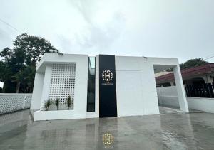a white building with a sign in front of it at The Luxurious 27, Johor Bahru in Johor Bahru