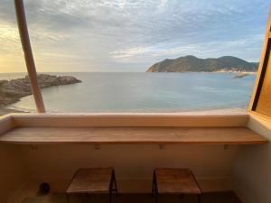 a window view of the ocean from a house at seaside villa HILIFE - Vacation STAY 27367v in Kogushi +1 photo