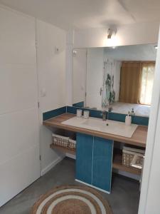a bathroom with a sink and a mirror at Charming, quiet house 7 minutes walk from center in Antibes