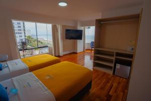 Postel nebo postele na pokoji v ubytování Golden Mar Hotel