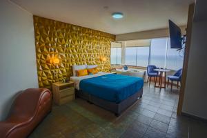 Postel nebo postele na pokoji v ubytování Golden Mar Hotel