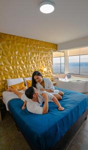 Postel nebo postele na pokoji v ubytování Golden Mar Hotel