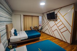 Postel nebo postele na pokoji v ubytování Golden Mar Hotel