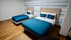 Postel nebo postele na pokoji v ubytování Golden Mar Hotel