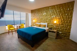 Postel nebo postele na pokoji v ubytování Golden Mar Hotel