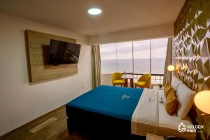 TV a/nebo společenská místnost v ubytování Golden Mar Hotel