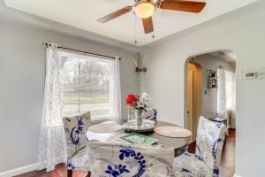a dining room with a table and chairs and a ceiling fan at Peaceful Detroit Home 10 Mi to Downtown! in Detroit