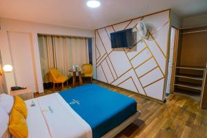 Postel nebo postele na pokoji v ubytování Golden Mar Hotel