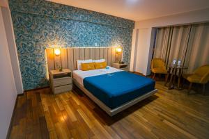 Postel nebo postele na pokoji v ubytování Golden Mar Hotel