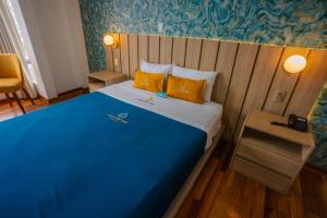 Postel nebo postele na pokoji v ubytování Golden Mar Hotel