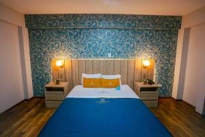 Postel nebo postele na pokoji v ubytování Golden Mar Hotel