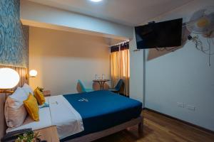 Postel nebo postele na pokoji v ubytování Golden Mar Hotel