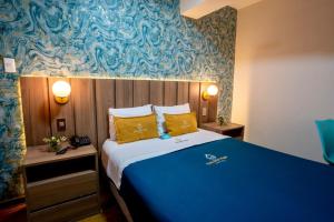 Postel nebo postele na pokoji v ubytování Golden Mar Hotel