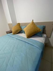 A bed or beds in a room at Apartamento en Bucaramanga