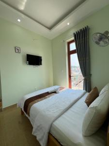 Postel nebo postele na pokoji v ubytování Alex Home Đà Lạt